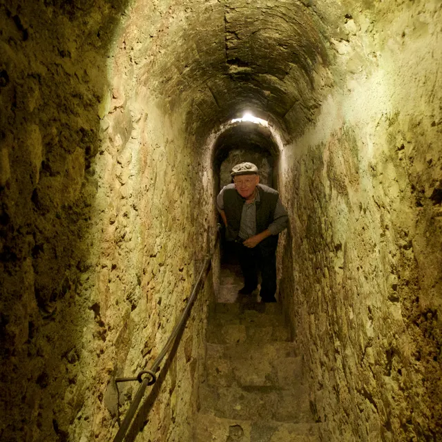 The narrow stone secret passage inside Bran Castle